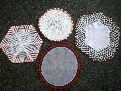 Four vintage beaded doilies