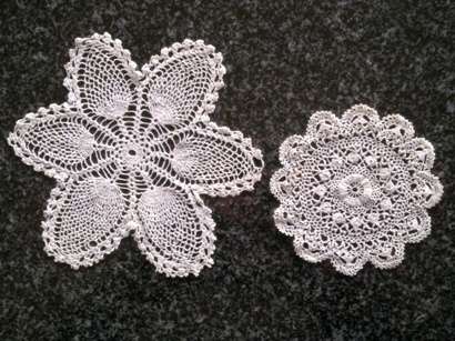 Two dainty little antique doilies