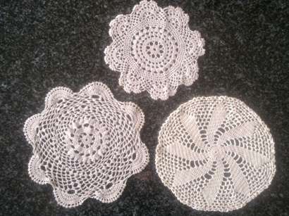 Three pretty sand coloured cotton crochet doilies