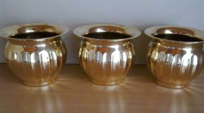 Three brass plant pots