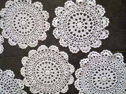 One dozen dainty crochet cotton doilies