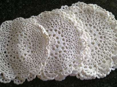 One dozen dainty crochet cotton doilies