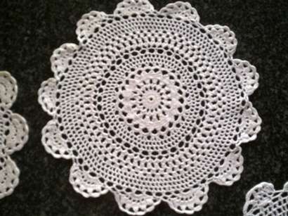 Five white cotton crochet doilies 23cm