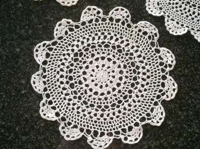 Five white cotton crochet doilies 23cm