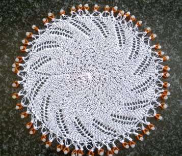 Unusual knitted glass beaded doilie