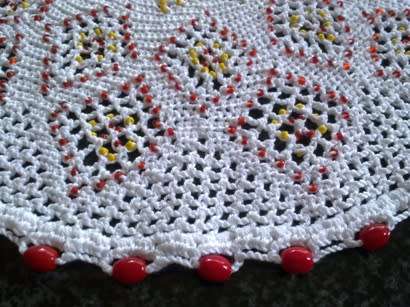 Large vintage glass beaded doilie with red and yellow seed beads