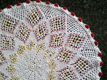 Large vintage glass beaded doilie with red and yellow seed beads