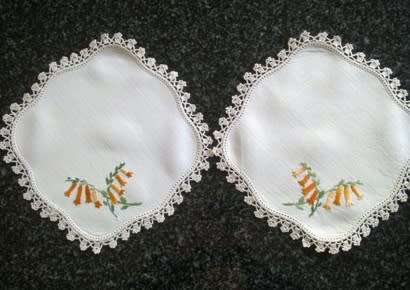 Pretty pair of hand embroidered linen doilies 20cm