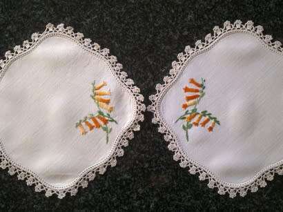 Pretty pair of hand embroidered linen doilies 20cm