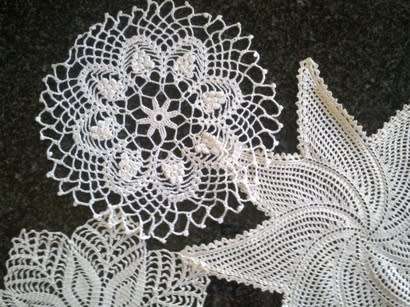 Collection of five cotton crochet doilies