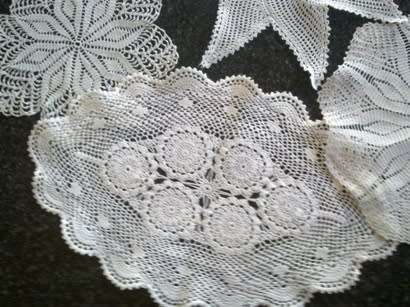 Collection of five cotton crochet doilies
