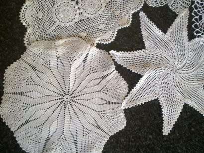Collection of five cotton crochet doilies