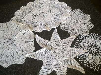 Collection of five cotton crochet doilies