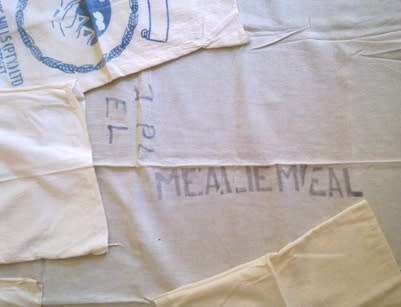 Three vintage flour sacks & fabric pieces