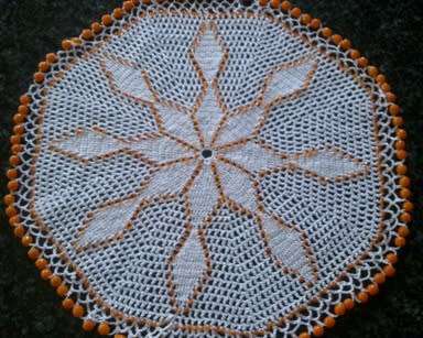 White cotton crochet doilie with orange glass beads 22cm