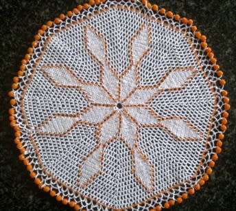 White cotton crochet doilie with orange glass beads 22cm