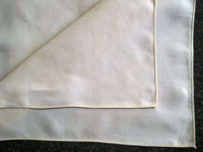 Pair of ivory Irish linen dinner serviettes