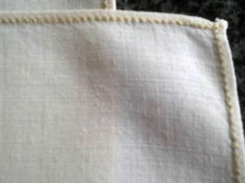 Pair of ivory Irish linen dinner serviettes