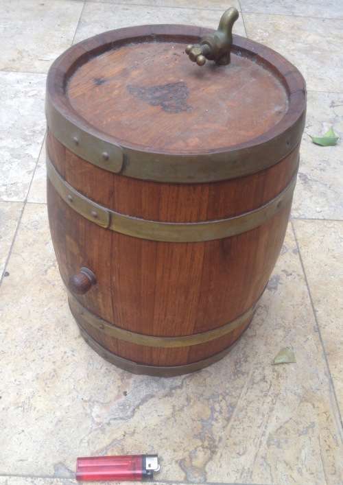 wooden barrel with brass rings and tap