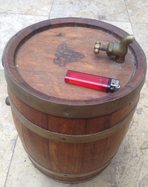 wooden barrel with brass rings and tap