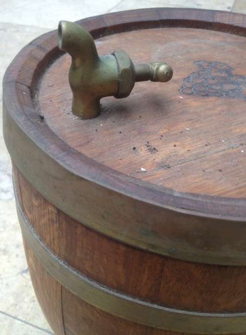 wooden barrel with brass rings and tap