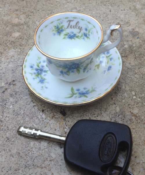 Royal Albert miniature teacup and saucer , flower of the month , July