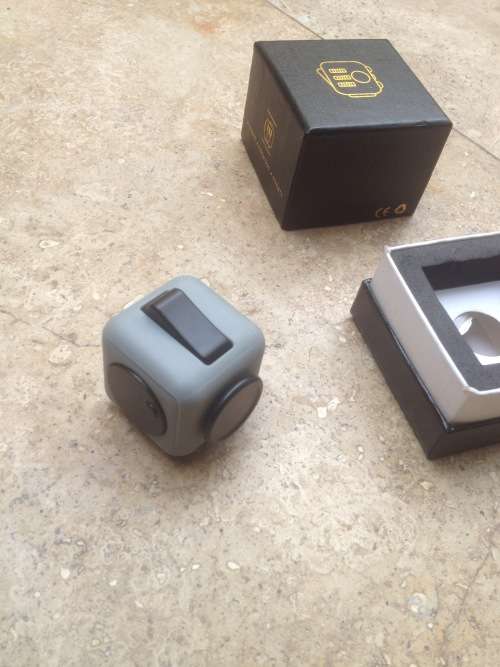 fidget stress cube toy , grey and black boxed