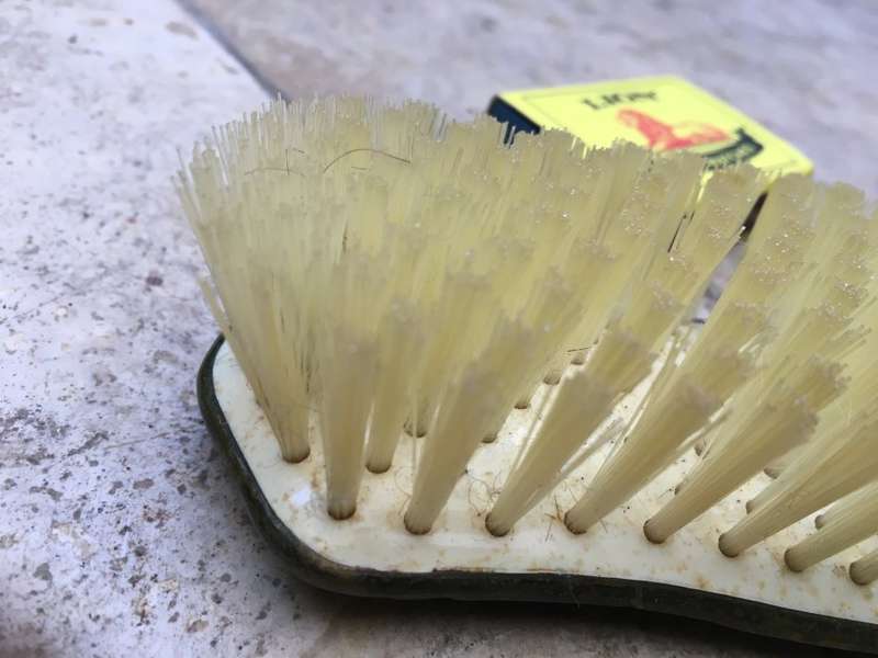 vintage clothes hair brush pair , brass handled , hand painted