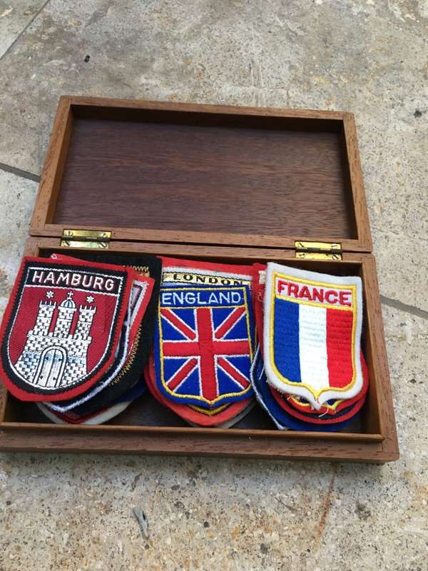 vintage lot of 39  europe travel badges in vintage nautical wooden box