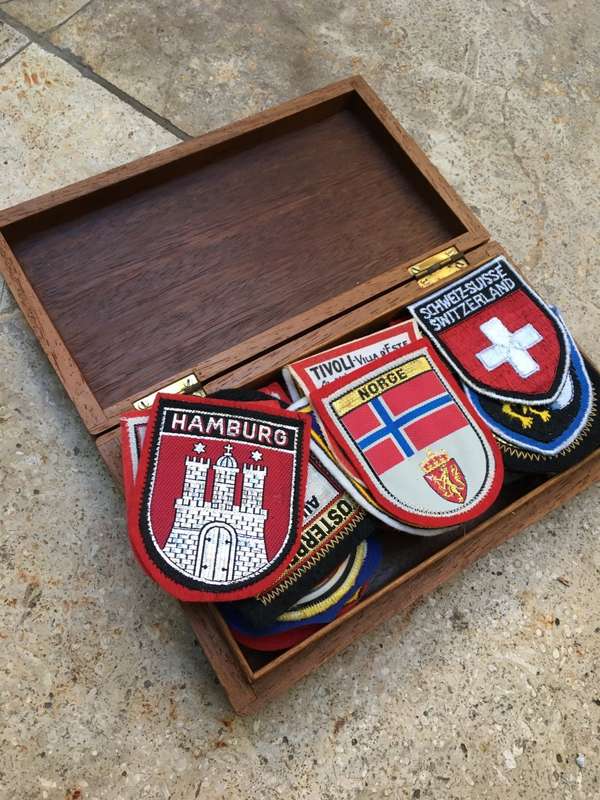 vintage lot of 39  europe travel badges in vintage nautical wooden box