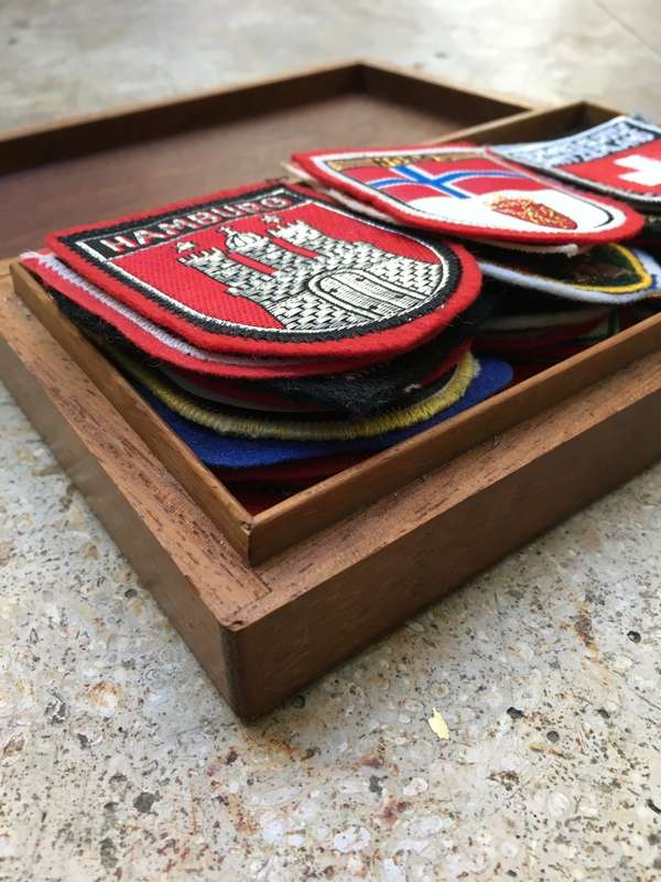 vintage lot of 39  europe travel badges in vintage nautical wooden box