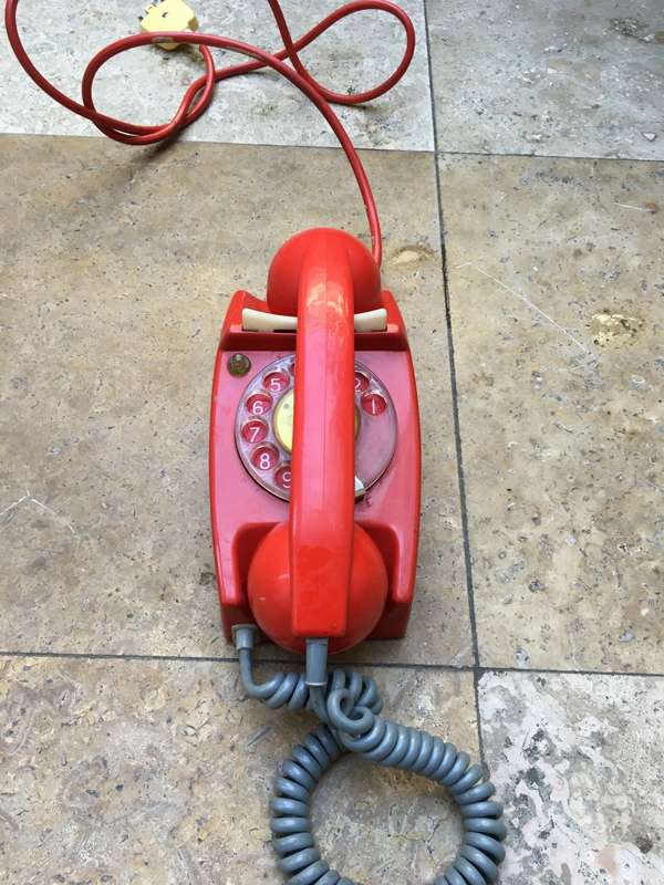 vintage red retro rotary dial up telephone