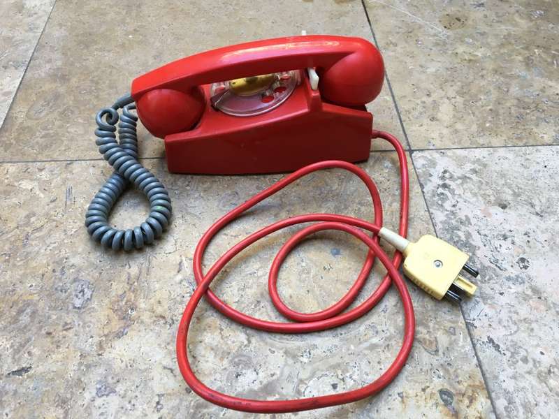 vintage red retro rotary dial up telephone