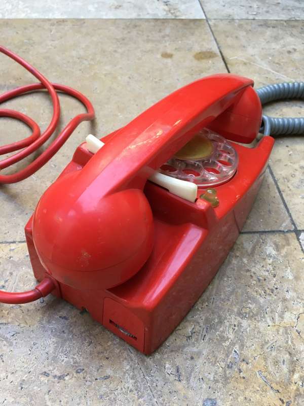 vintage red retro rotary dial up telephone