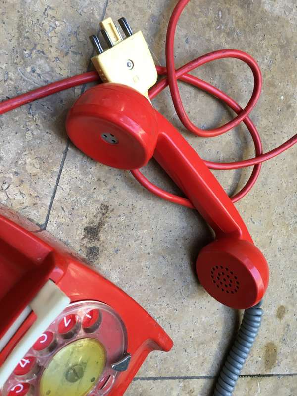 vintage red retro rotary dial up telephone