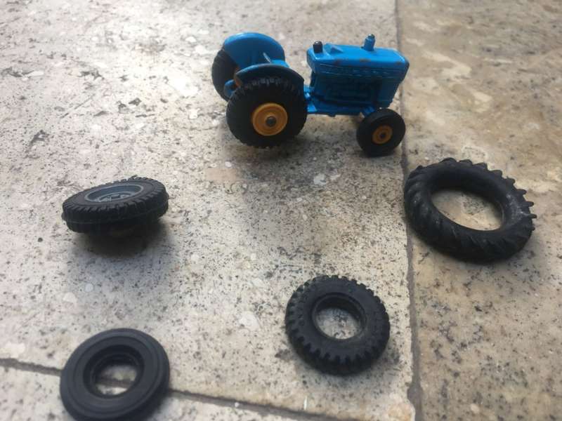 lesney matchbox series 39 ford tractor , missing a wheel , with spare Corgi wheels
