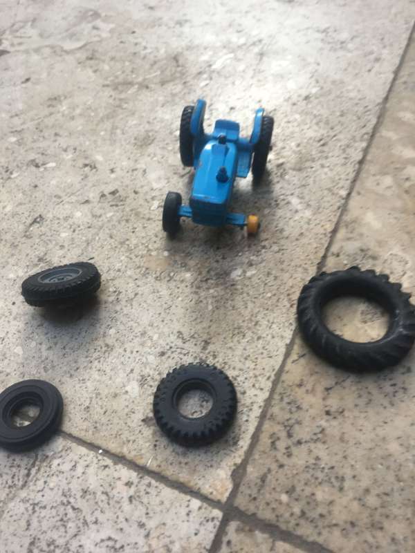 lesney matchbox series 39 ford tractor , missing a wheel , with spare Corgi wheels