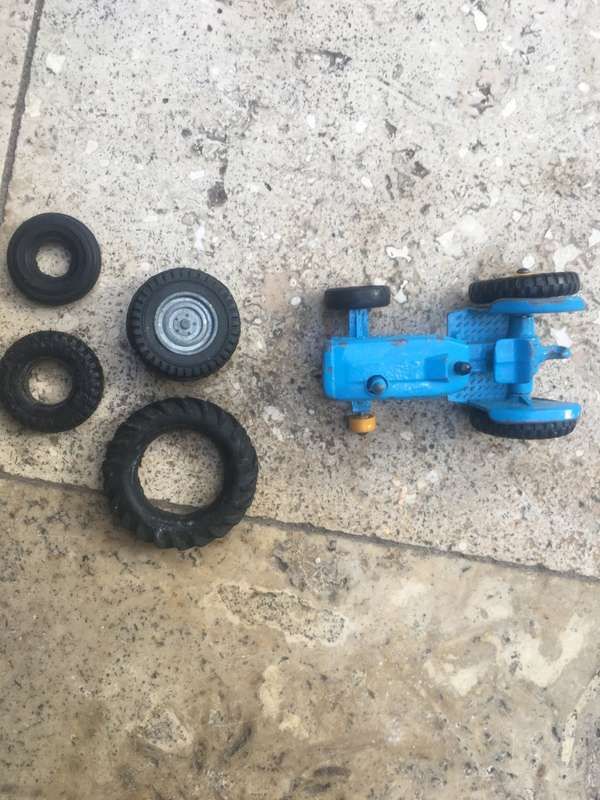 lesney matchbox series 39 ford tractor , missing a wheel , with spare Corgi wheels
