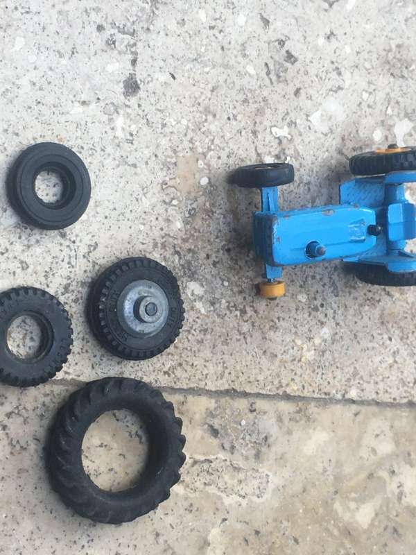 lesney matchbox series 39 ford tractor , missing a wheel , with spare Corgi wheels