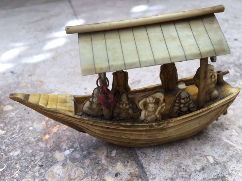 vintage japan celluloid boat pair carrying buddha and vip