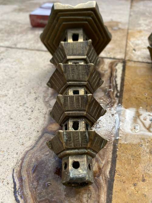vintage brass pagoda incense holder and pagoda candle stick holder pair