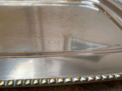 vintage silver plated footed rectangular brass tray with signs of age