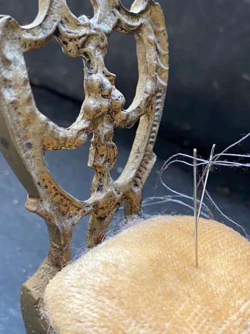 vintage brass pin needle cushion chair