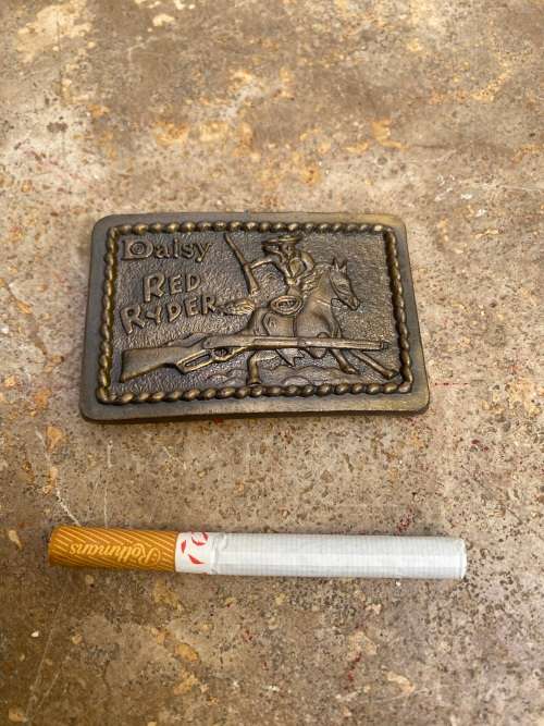 vintage Daisy red ryder belt buckle 1952