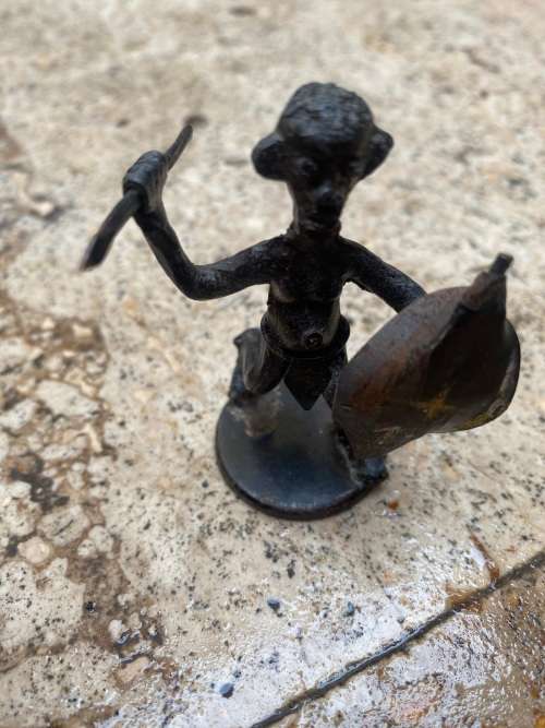 vintage copper ostrich and copper african hunter figure  pair of figurines
