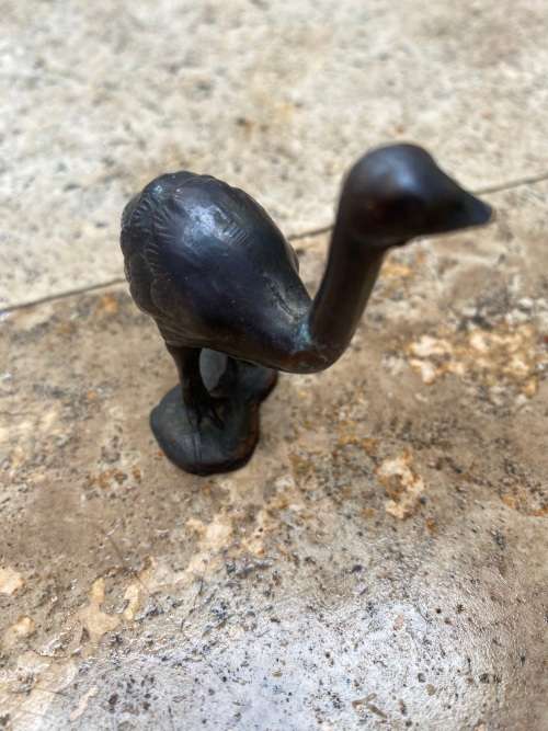 vintage copper ostrich and copper african hunter figure  pair of figurines