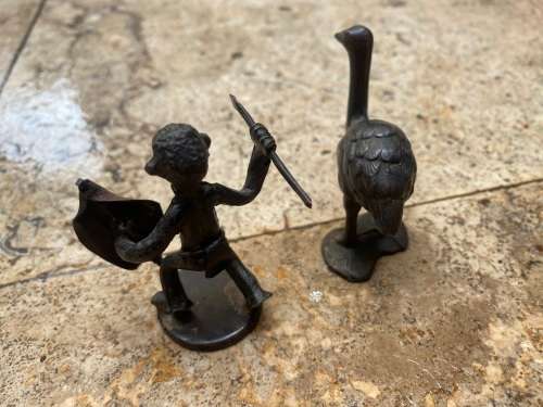 vintage copper ostrich and copper african hunter figure  pair of figurines