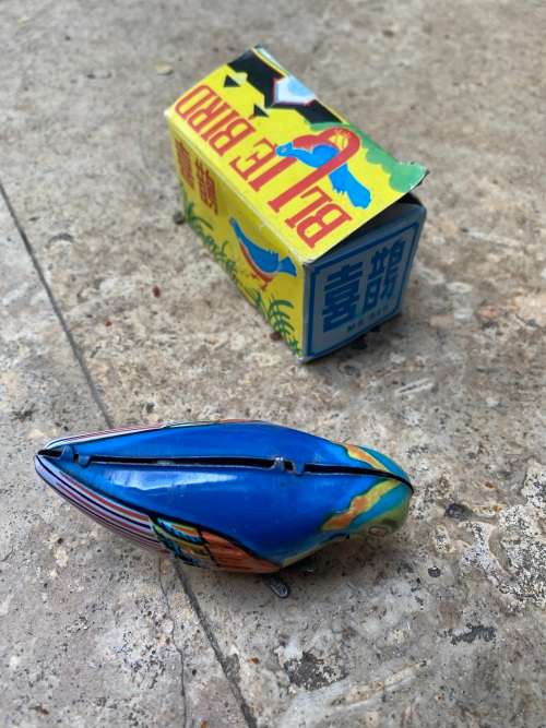 vintage blue bird wind up tin toy from 60s