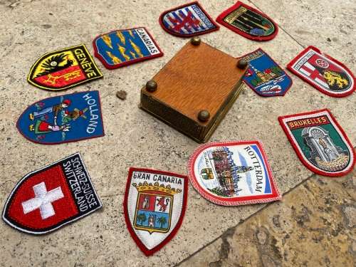 Vintage Rachels tomb brass trinket box footed with 11 travel badges