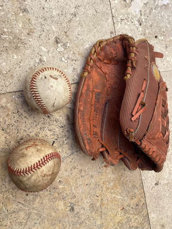 Vintage leather flame baseball  base ball mitt glove and a pair of old Wilson ball balls